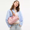 Sac porté épaule Erin en Signature Canvas avec Charms