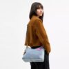 Sac porté épaule Laurel en denim « Loved » avec Charms