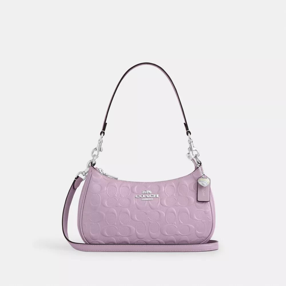 Sac porté épaule Teri en cuir signature avec breloque en forme de cœur
