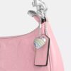 Sac porté épaule Teri en cuir signature avec breloque en forme de cœur
