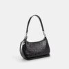Sac porté épaule Teri en cuir Signature avec breloque en forme de cœur