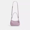 Sac porté épaule Teri en cuir signature avec breloque en forme de cœur
