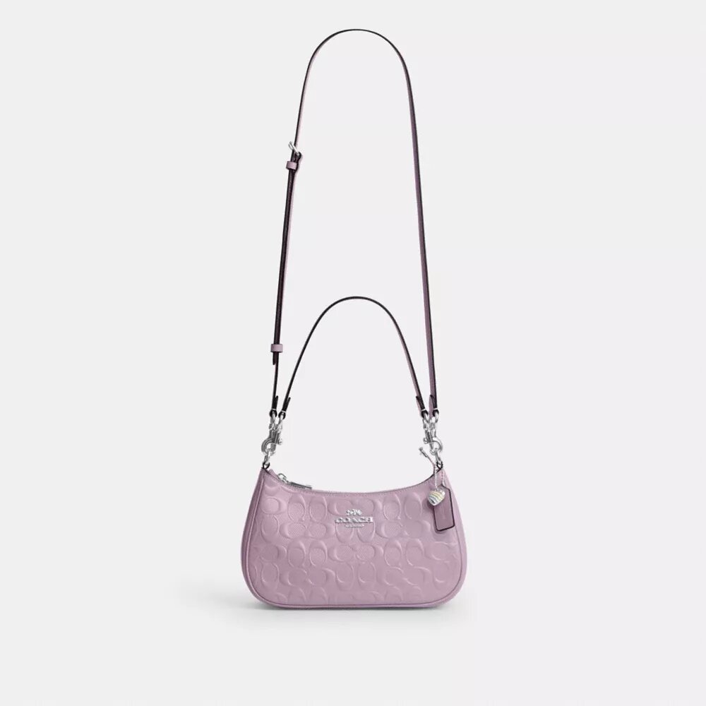 Sac porté épaule Teri en cuir signature avec breloque en forme de cœur