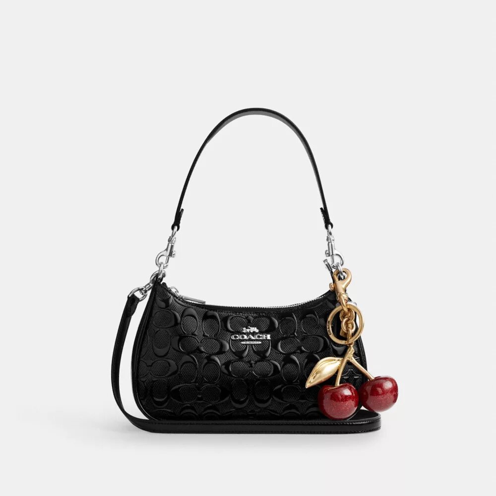 Sac porté épaule Teri en cuir Signature avec breloque en forme de cœur