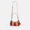 Sac porté épaule Teri à rayures et breloque