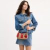 Sac porté épaule Teri à rayures et breloque
