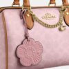 Sac Rowan en Signature Canvas avec Charms