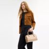 Sac satchel Rowan en Signature Canvas à motifs géométriques