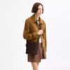Sac seau Bleecker 21 en Signature Canvas