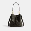 Sac seau Rowan en Signature Canvas avec Charms