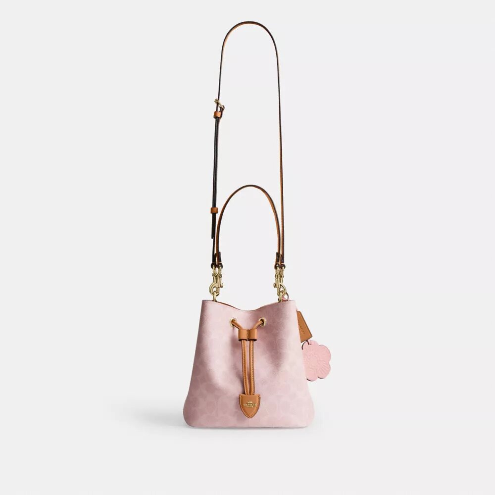 Sac seau Rowan en Signature Canvas avec Charms