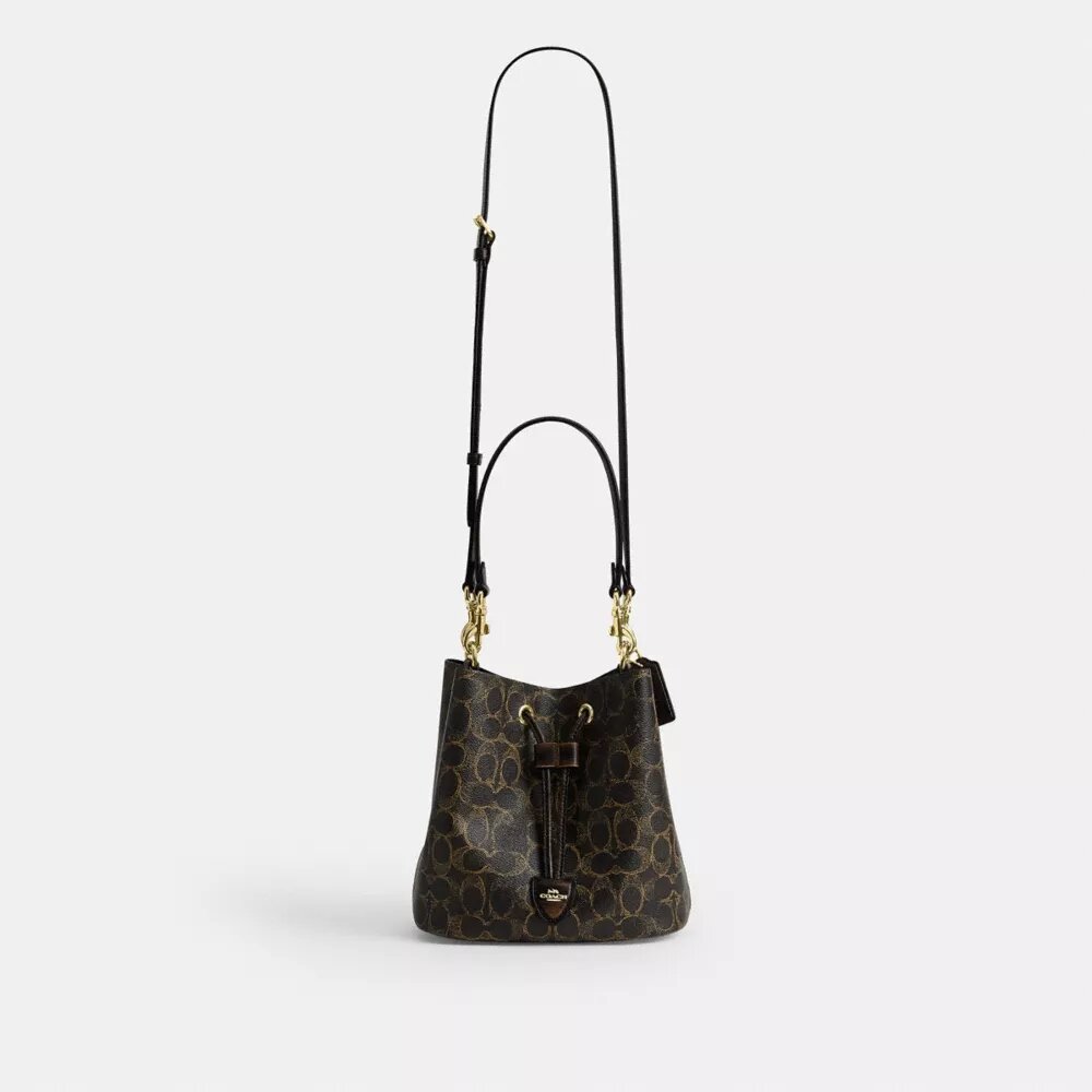 Sac seau Rowan en Signature Canvas avec Charms