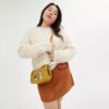 Sac Swinger Disney x Coach en cuir régénéré avec Mickey Mouse et ses amis