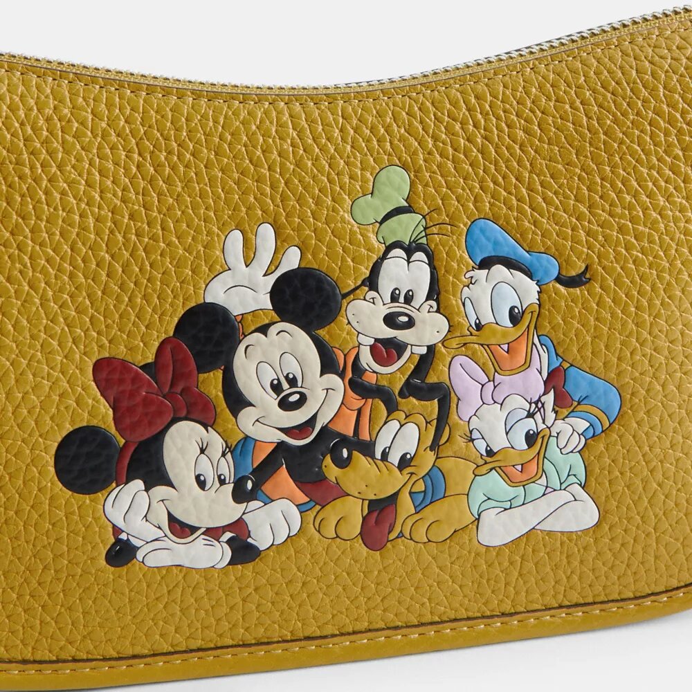 Sac Swinger Disney x Coach en cuir régénéré avec Mickey Mouse et ses amis