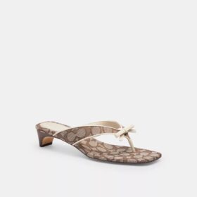 Sandales à talon bas avec bride en forme de nœud en jacquard emblématique