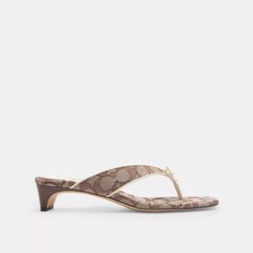 Sandales à talon bas avec bride en forme de nœud en jacquard emblématique