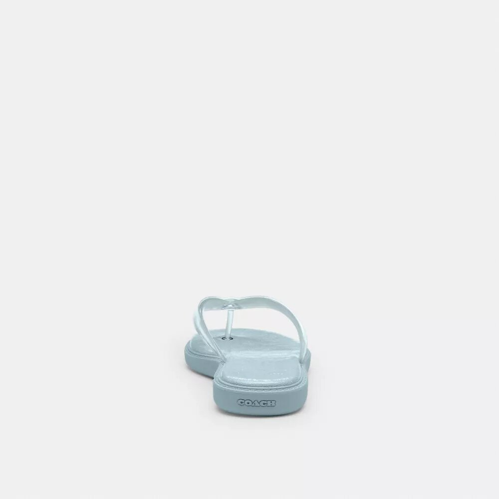 Tongs en plastique transparent dans notre motif emblématique