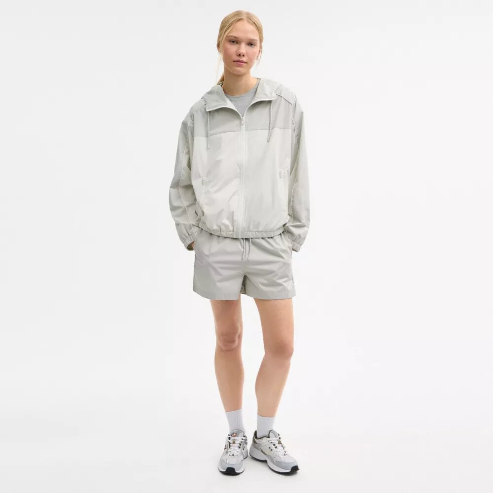 Veste coupe-vent à capuche
