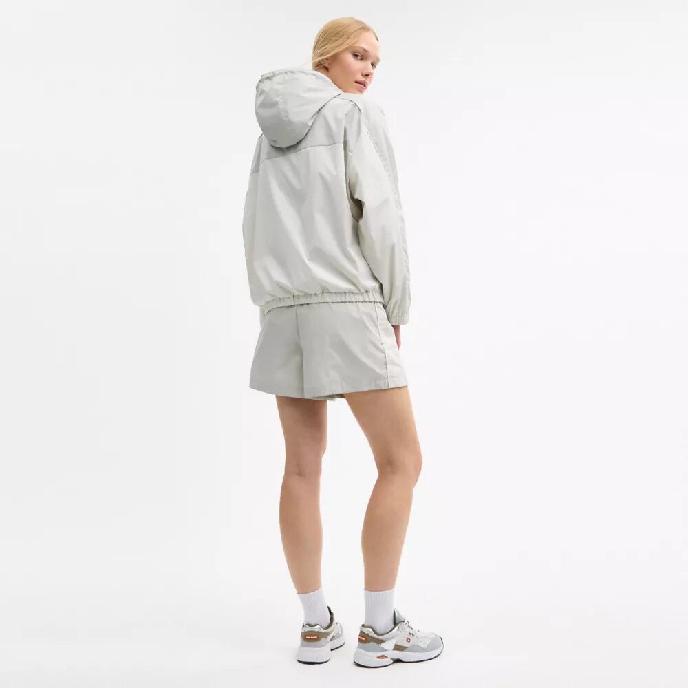 Veste coupe-vent à capuche