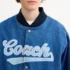 Veste universitaire en denim de coton biologique